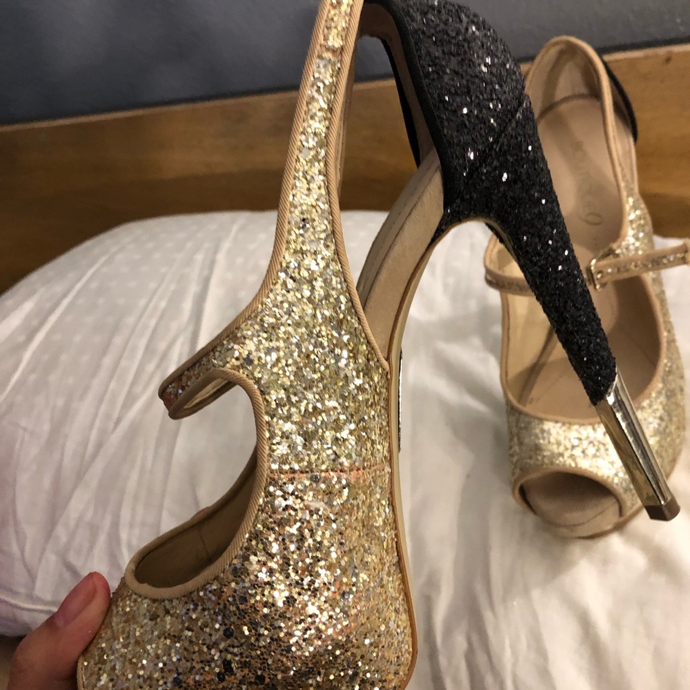 Gold/black heels with silver bottom